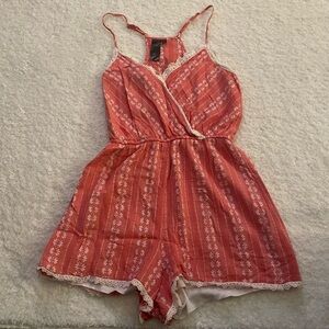 Boutique Pink floral with lace trim romper. Size Small